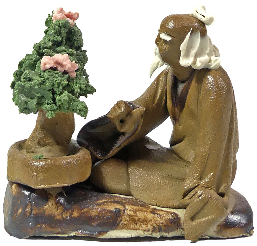 Handbemalte Miniatur eines Bonsai-Meisters mit blühendem Bonsai.